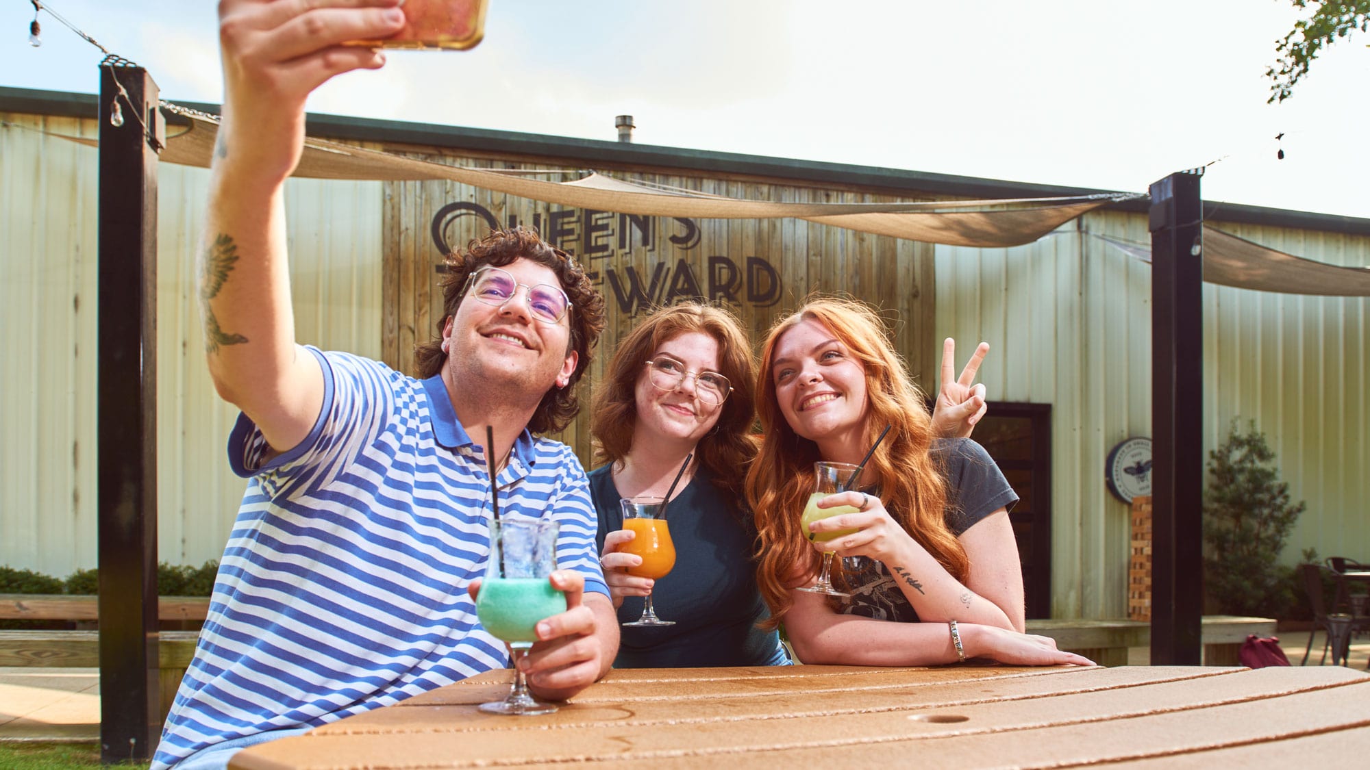 hero-hospitality-min friends taking a selfie at Queen's Reward Meadery in Tupelo, MS.