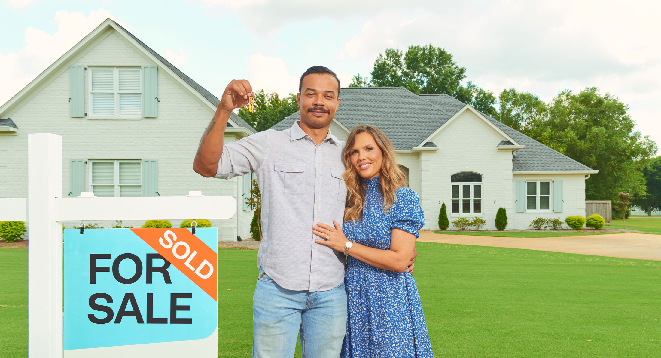 home-housing-keys couple smiling in front of their newly purchased home in Tupelo, MS.