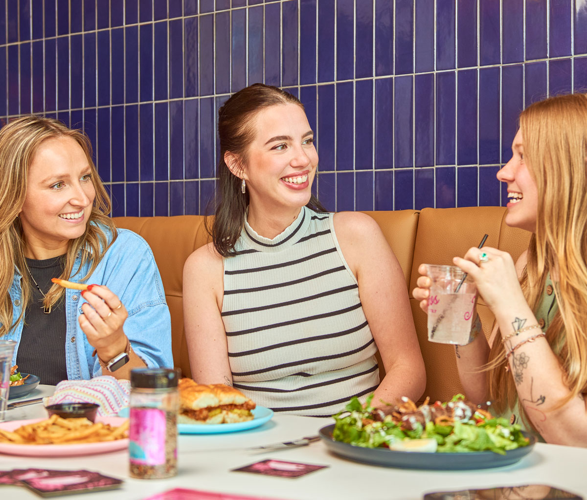 smiling friends enjoying lunch at Jobos in Tupelo, MS